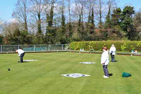 painting of bowlers on the green