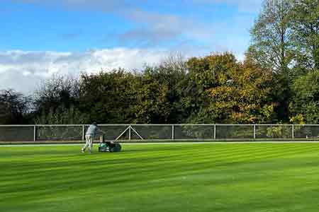 Person mowing green