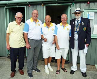 4 TCBC bowlers with a cup.